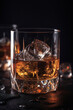 whiskey in a glass with ice on a black table close-up
