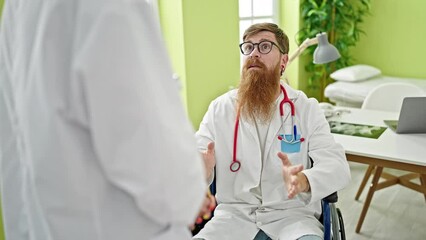 Poster - Man and woman doctors sitting on wheelchair speaking at clinic