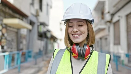 Poster - Young blonde woman architect smiling confident standing at street