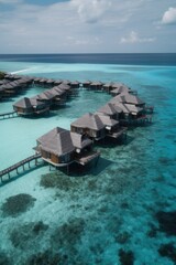 Wall Mural - Amazing drone view of the beach and water with beautiful colors. luxury tropical resort or hotel with water villas and beautiful beach scenery. maldives, summer vacation, resort maldivian houses.