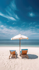 chaise lounge and umbrella on sand beach