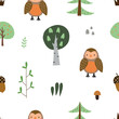Seamless pattern with colorful owls surrounded by forest elements. Vector illustration for textile and nursery decoration