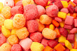 Freeze Dried Rainbow Flavored and Pastel Colored Chewy Candy Squares on a White Background