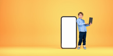 Poster - Boy with laptop standing near big smartphone with blank screen,