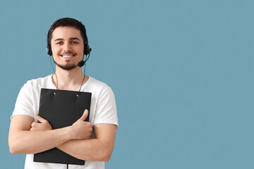 Wall Mural - Male technical support agent with clipboard on blue background