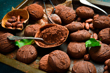 Wall Mural - Chocolate brownie cookies with cherry jam. Side view. On a dark background.