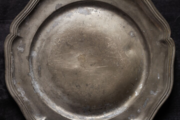 Close up of vintage pewter plate