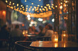 Table with candles of outdoor restaurant at night. 
