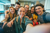 Group of young tourists standing in youth hostel guest house - Happy multiracial friends booking summer vacation home - Guys and girls having fun taking selfie picture at summertime holidays