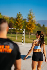 Wall Mural - Sporty couple walking and talking