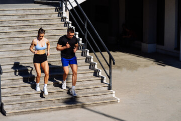 Wall Mural - Fitness couple running downstairs