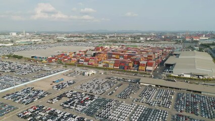 Wall Mural - Aerial view of container cargo ship in the export and import business and logistics international goods in urban city. Shipping to the harbour by crane in Bangkok harbour, Thailand.