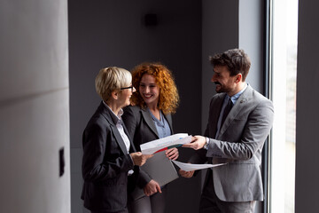 Group of well dressed business people working together