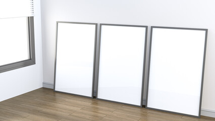 Poster - three empty frames lean against a wall in a minimalist room, featuring wooden flooring and a window,