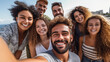 © Julia - A diverse group of friends, consisting of both males and females, capturing a selfie using a smartphone while being outdoors. They are all wearing smiles on their faces, conveying Generative AI