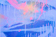 Leinwandbild Motiv Messy paint strokes and smudges on an old painted wall. Purple, beige, white color drips, flows, streaks of paint and paint sprays