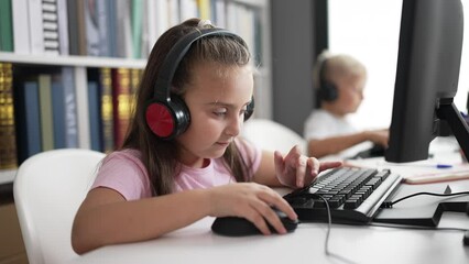 Poster - Adorable boy and girl students using computer and headphones studying at classroom