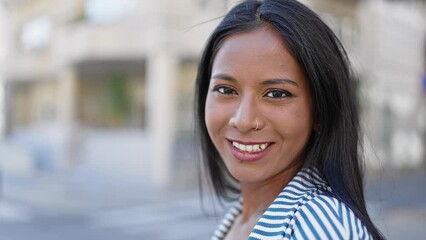 Wall Mural - African american woman smiling confident standing at street