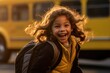 A young girl as she poses close - up with her school backpack waiting in front of a yellow school bus. Generative AI