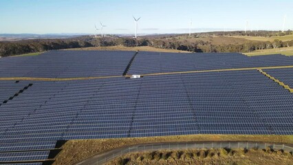 Wall Mural - aerial drone view of a hybrid wind and solar farm for renewable clean energy supply located at banni