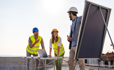 Wall Mural - Group of engineers, architects, business partners at construction site working together