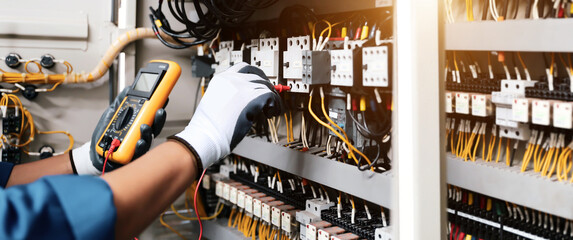 electricity and electrical maintenance service, engineer hand checking electric current voltage at c