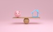 © ImagesRouges - House and piggy bank balancing on a seesaw.