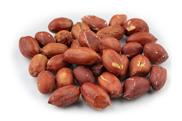 Wall Mural - Dried peanuts in closeup isolated on white background.