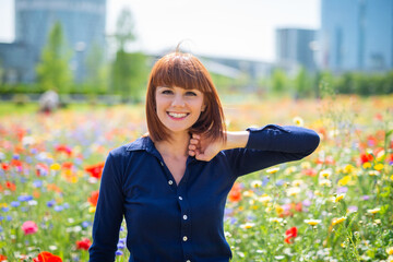 Joyful woman in a flowers field