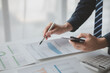 © PHOTO4U - Businessman in a private office at his company and is reviewing company financial documents, senior management checking financial information for accuracy. Financial management.