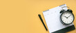 Concept of plan a monthly calendar for meetings or manage your daily activities.Yellow banner. Copy space.