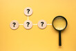 QnA or questions and answers concept.Question mark with magnifying glass on a diagram. 