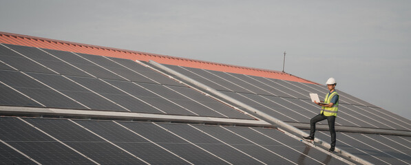 service engineer checking solar cell on the roof for maintenance if there is a damaged part. enginee