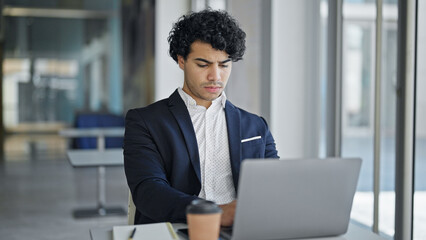 Sticker - Young latin man business worker using laptop at office