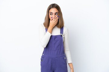 Young caucasian woman isolated on white background doing surprise gesture while looking to the side