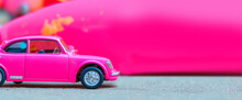 Macro Illusration Of Toy Pink Car Bokeh Backround.Space For Text .Generative AI