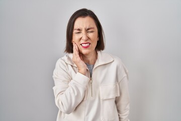 Sticker - Middle age hispanic woman standing over isolated background touching mouth with hand with painful expression because of toothache or dental illness on teeth. dentist