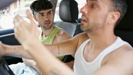 Wall Mural - Two men couple driving car arguing at street