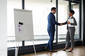 Business people shaking hands, finishing up a meeting