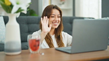 Sticker - Young beautiful hispanic woman having video call sitting on floor at home