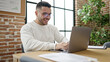 © Krakenimages.com - Young hispanic man business worker using laptop working at office