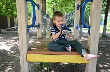 Toddler boy with his shoes