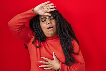 Sticker - Plus size hispanic woman standing over red background touching forehead for illness and fever, flu and cold, virus sick