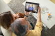 © Prostock-studio - Telemedicine services. Senior spouses having video call with online doctor and getting professional health consultation