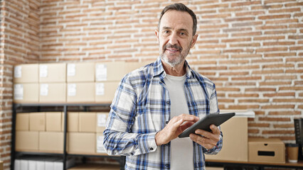 Sticker - Middle age man ecommerce business worker using touchpad at office