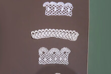 Handmade Knitted White Lace On Brown Background