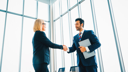 Poster - Business people handshake in corporate office showing professional agreement on a financial deal contract. Jivy