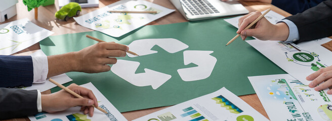 Group of business people planning and discussing on recycle reduce reuse policy symbol in office meeting room. Green business company with eco-friendly waste management regulation concept.Trailblazing