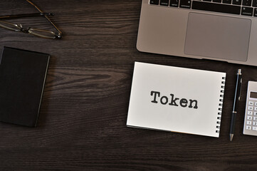 Poster - There is notebook with the word Token. It is as an eye-catching image.