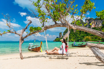 Wall Mural - Traveler woman relaxing on swing joy nature view scenic landscape Phakbia beach Krabi, Attraction famous place tourist travel Phuket Thailand summer holiday vacation trip, Beautiful destination Asia